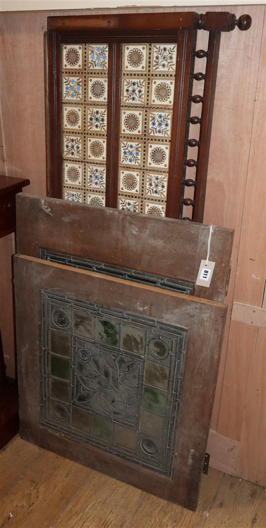 A pair of late Victorian stained glass panels and a Victorian tiled splashback panels 47 x 51cm